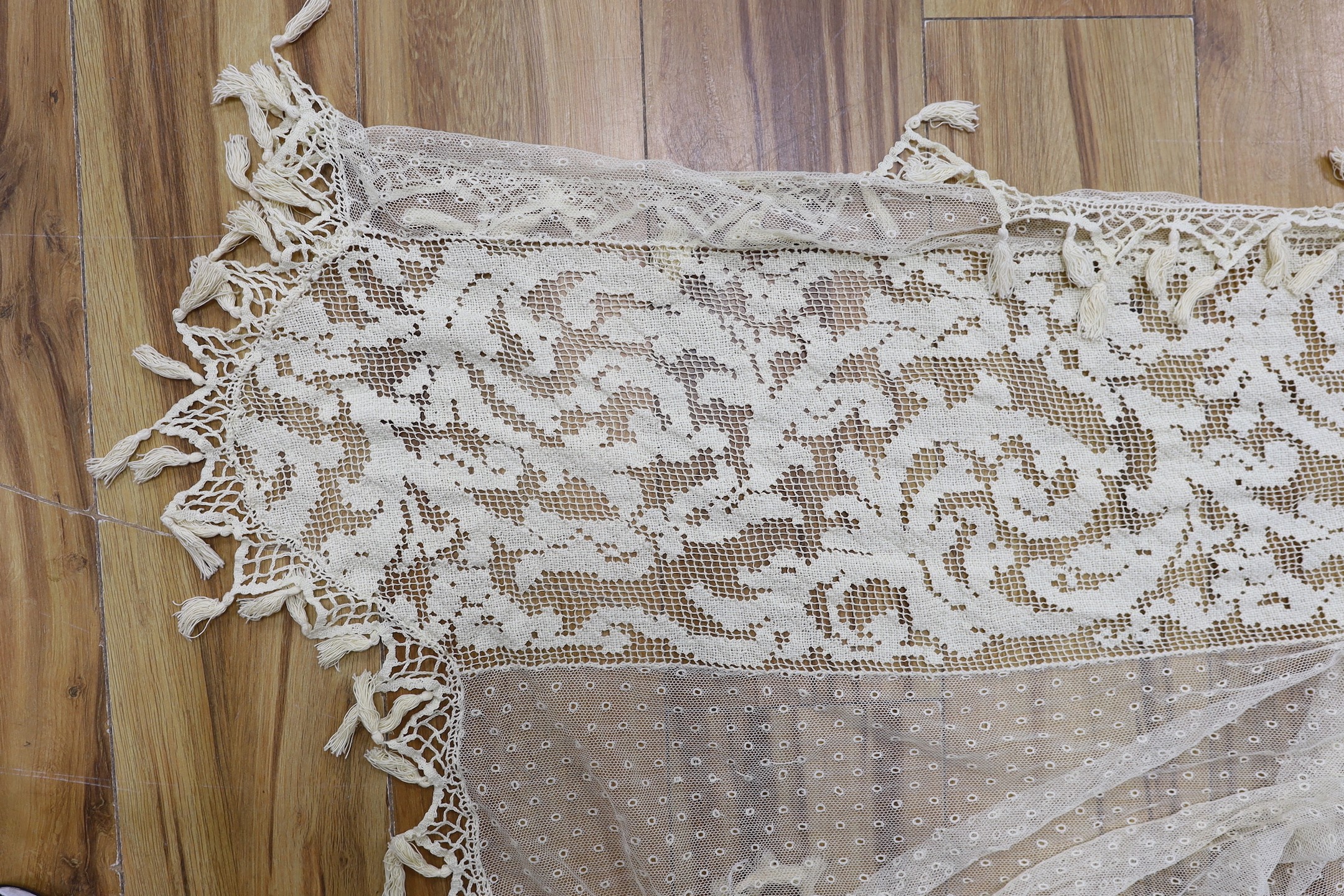 A pair of Edwardian fine net curtains bordered with wide fillet lace, edged with tasselled bobbin lace 272 x 155cm